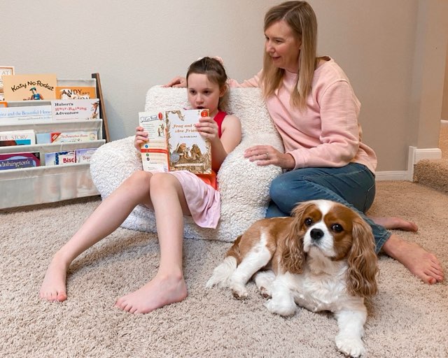 child reading a decodable text